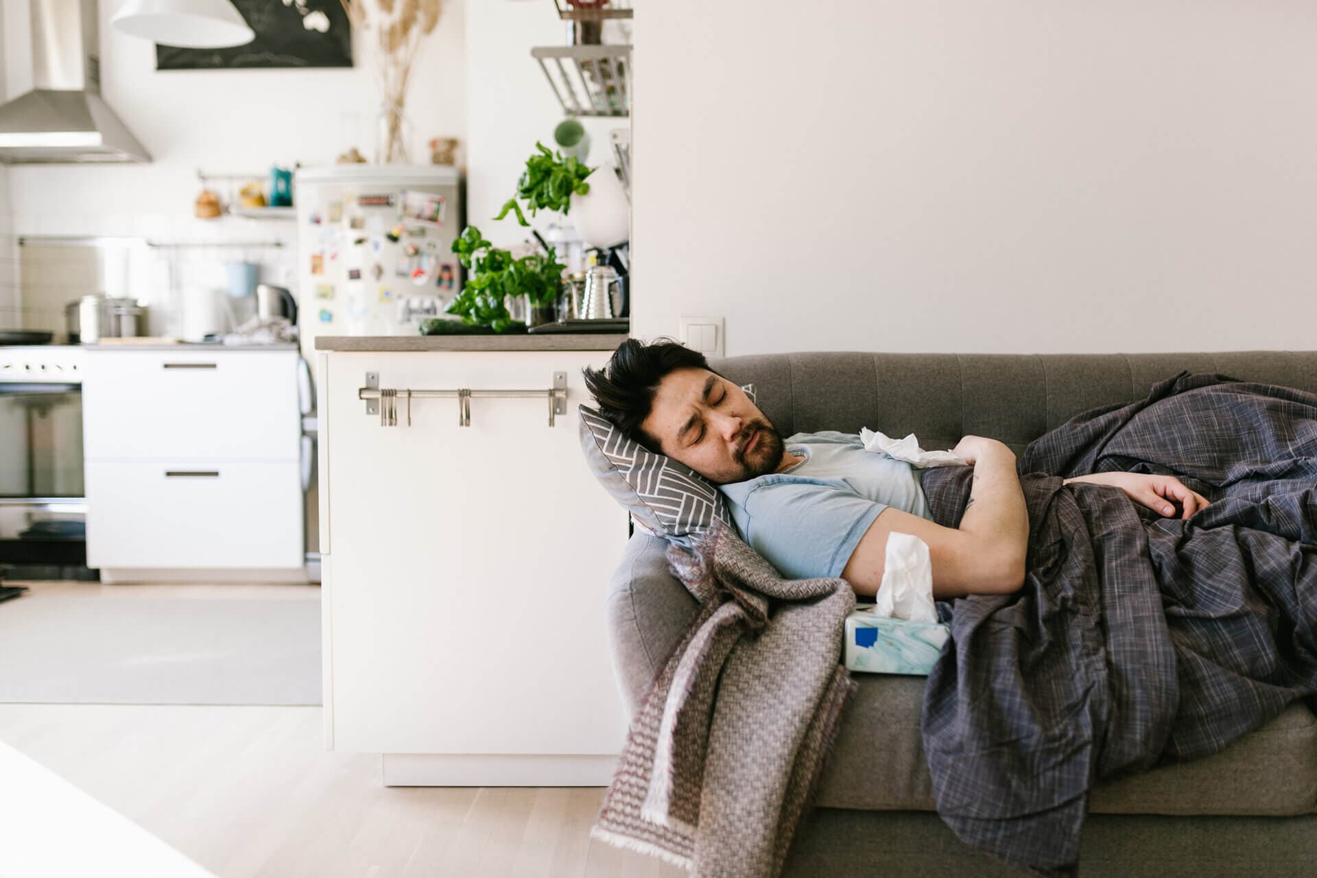 man sick on the couch