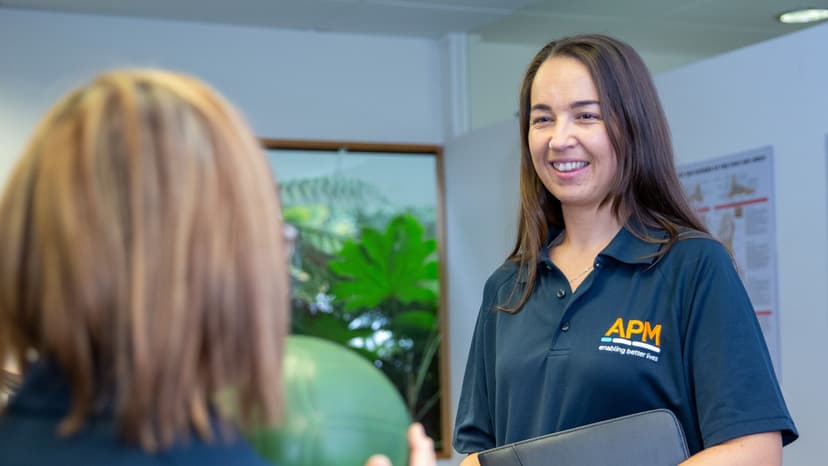 APM Physio smiles during health check