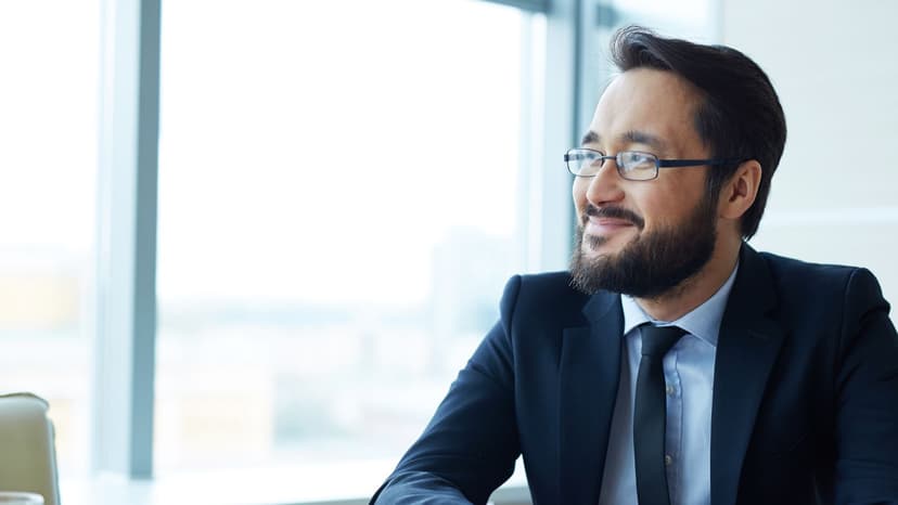 man in suit smiles