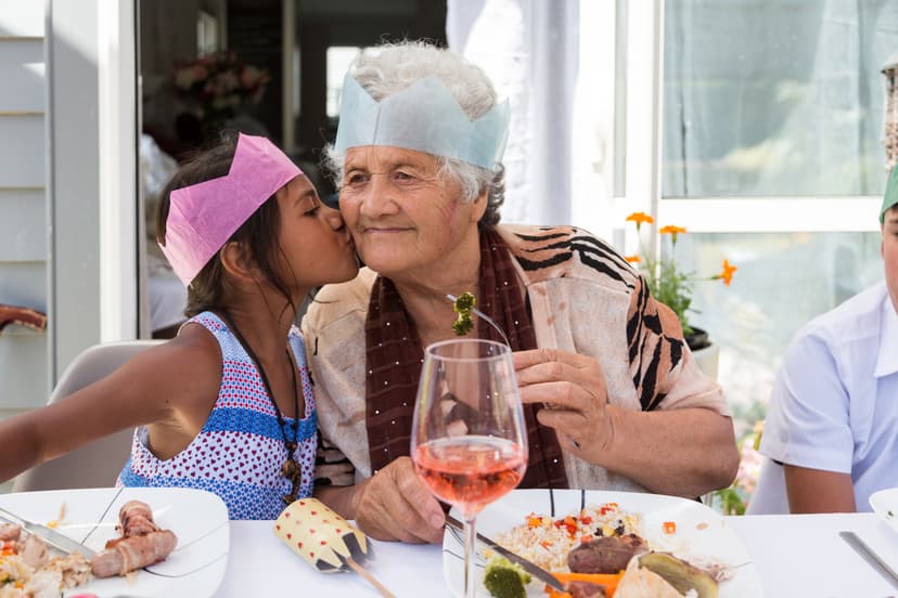 Young child and older woman celebrating a festive occasion together
