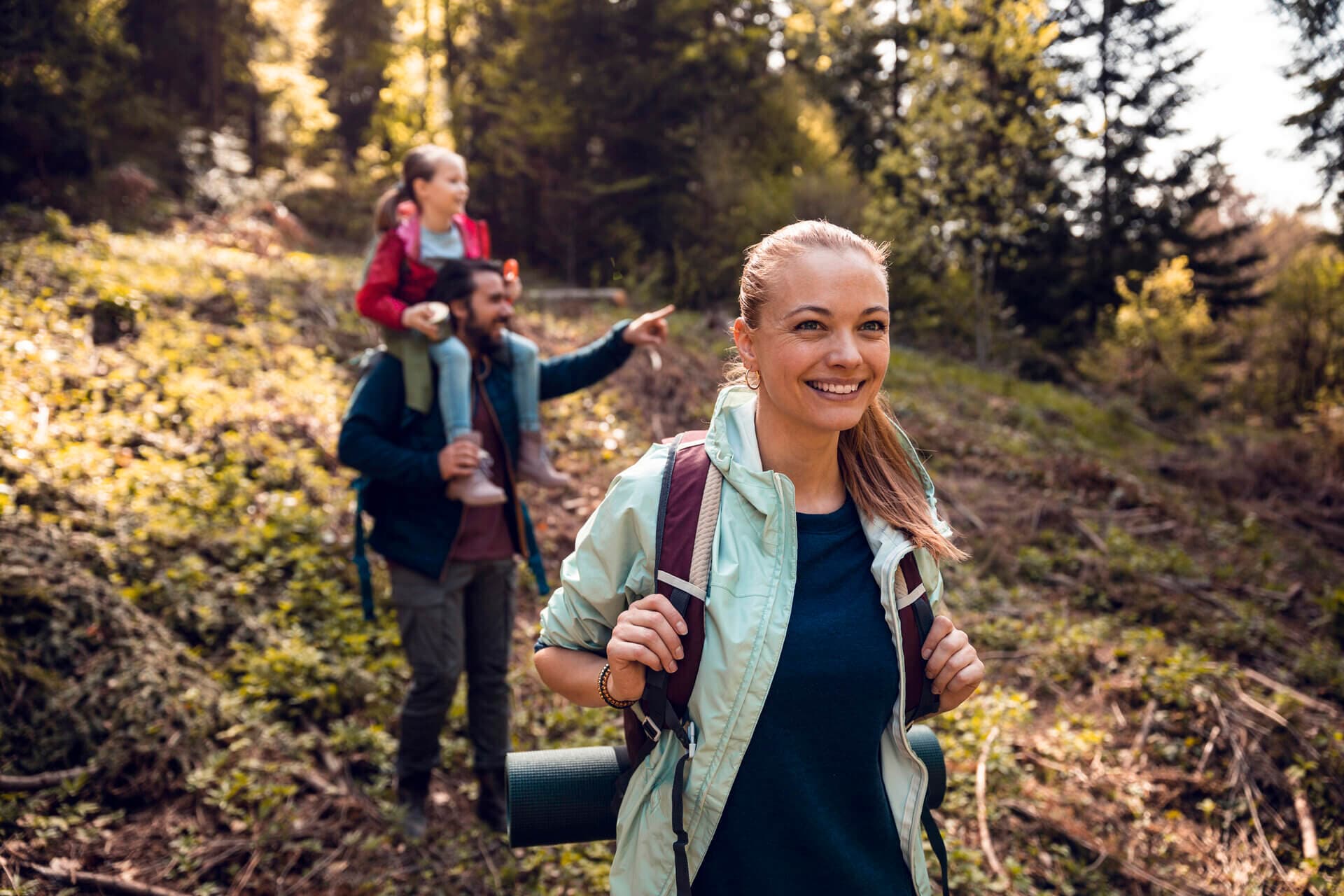 family hiking in woods