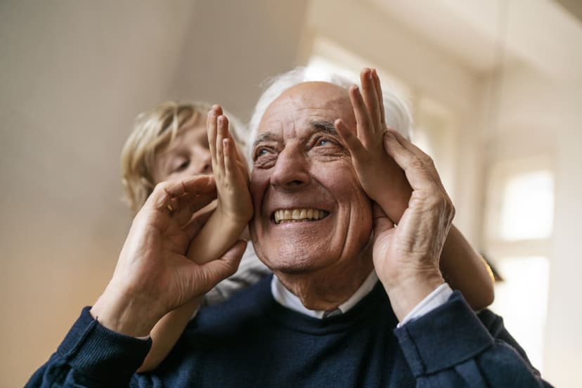 Young child and older woman celebrate festive occasion together