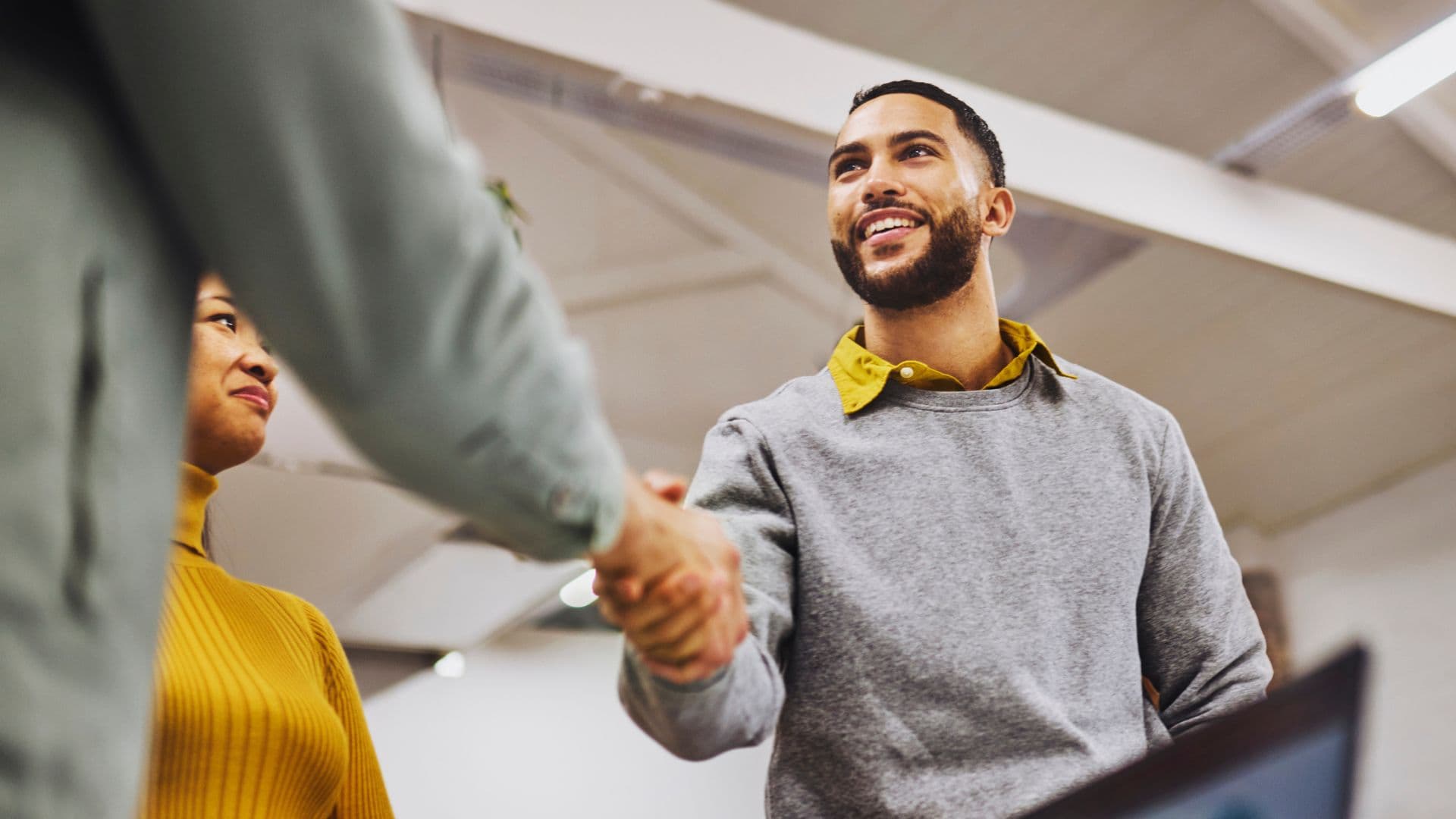 Man shakes hands with new employer